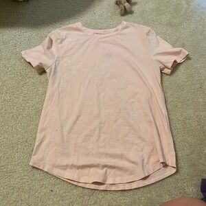 new condition, worn once, pink short sleeve lululemon top, size 2 can fit 4